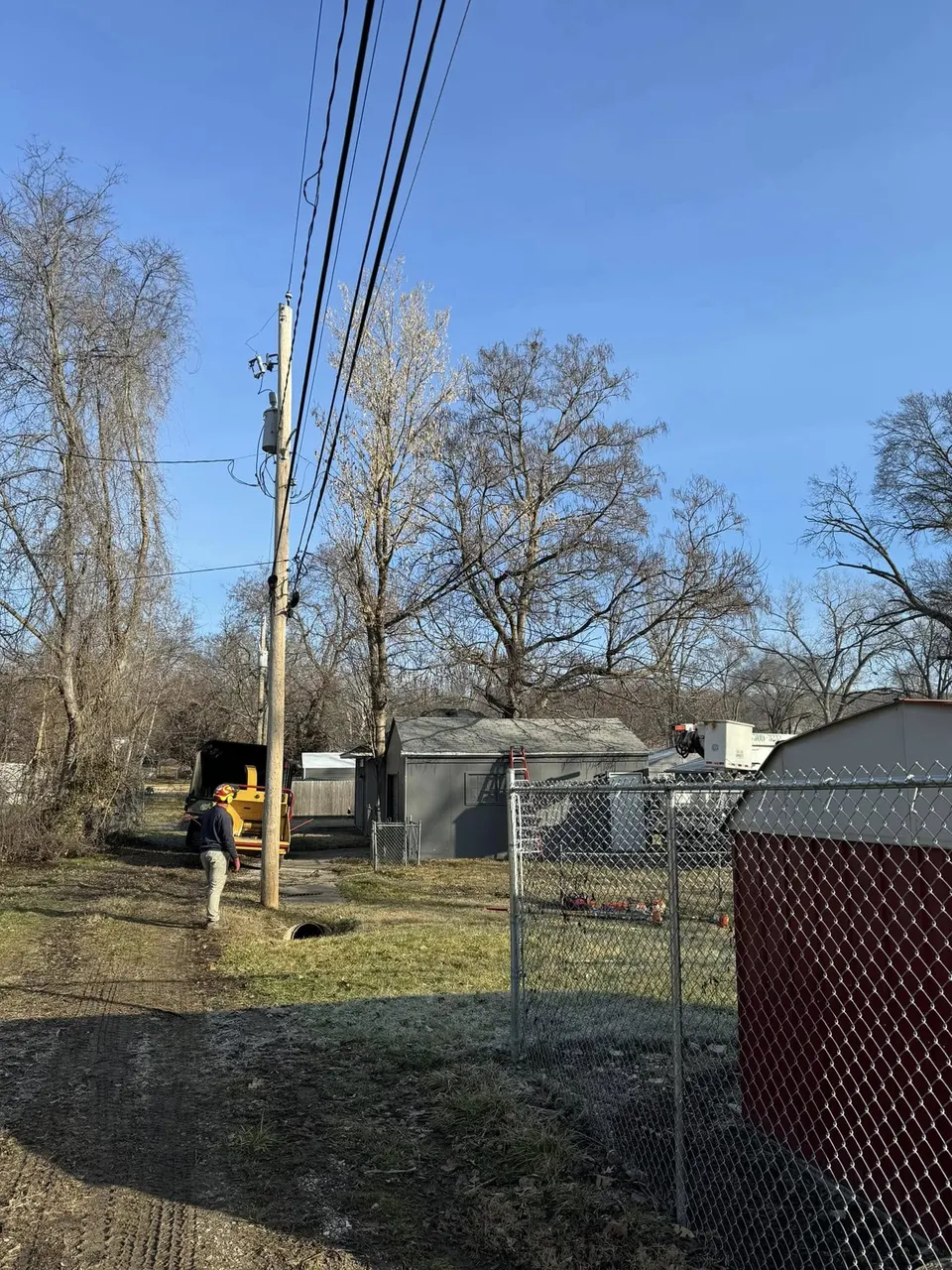 Wood chipper processing brush during lot clearing in Shawnee, Kansas